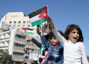 Jordanians attend a rally in support of Jordan's King Abdullah outside the Grand Hyatt hotel in central Amman November 10, 2005.