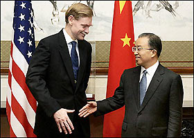 US Deputy Secretary of State Robert Zoellick (L) greets Chinese Deputy Foreign Minister Dai Bingguo in Beijing, August 2005.