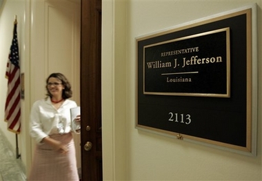 A reporter walks out of the Capitol Hill office of Rep. William Jefferson, D-La., in this June 4, 2007 file photo.